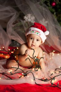 Christmas baby with string of lights